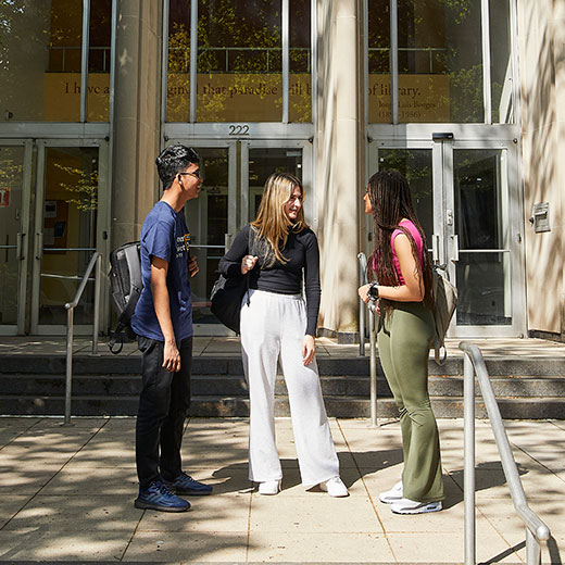 Three students talking. Links to Beneficiary Designations