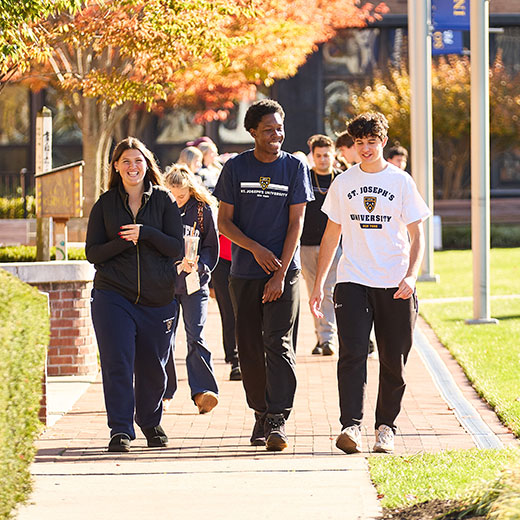 Students walking on campus. Links to Gifts of Appreciated Securities