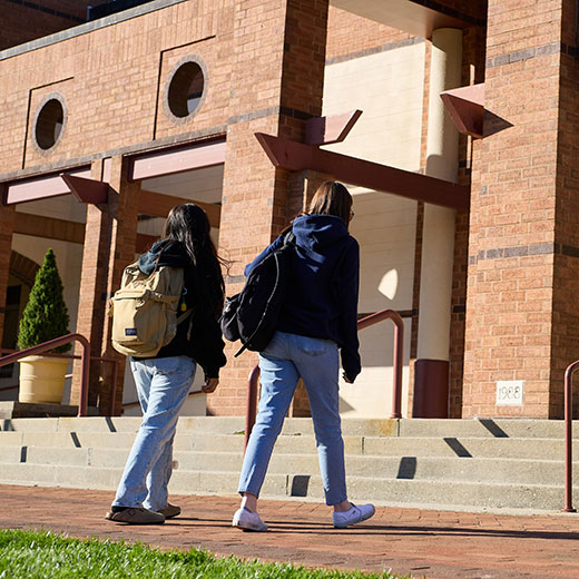 Students walking into the school library. Links to Gifts That Protect Your Assets